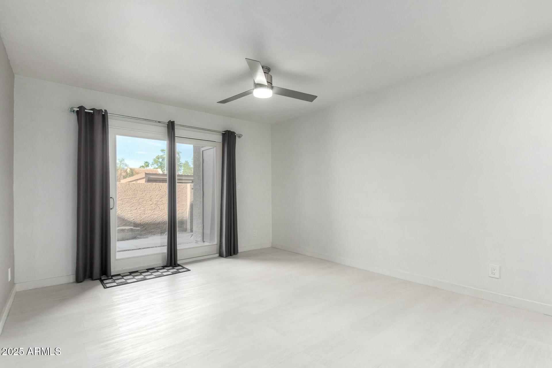 540 North May, Unit 1075 Mesa, AZ 85201 - Photo 17 of 23 an empty room with chandelier fan
