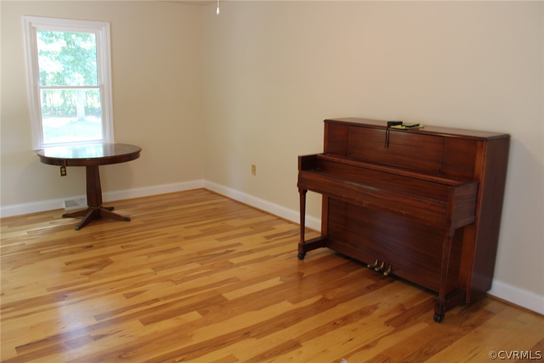 820 Modest Creek Road Victoria, VA 23974 - Photo 4 of 22 a room with a dresser and a window