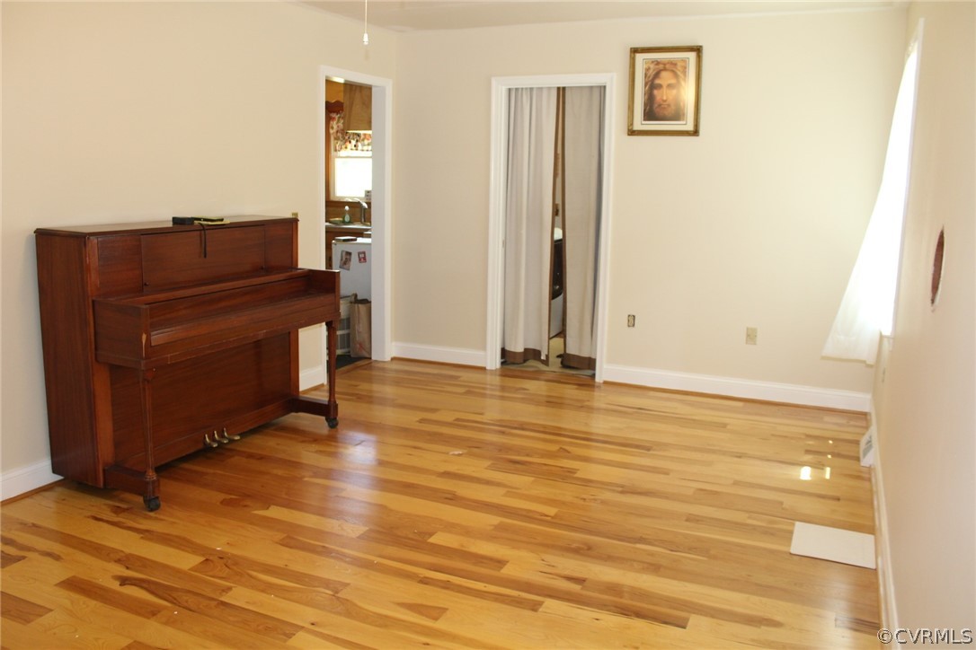 820 Modest Creek Road Victoria, VA 23974 - Photo 6 of 22 a view of room with wooden floor