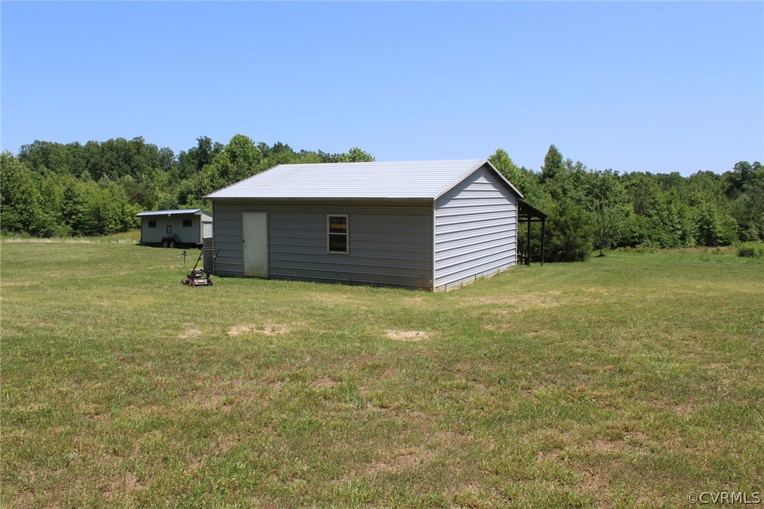 820 Modest Creek Road Victoria, VA 23974 - Photo 9 of 22 a backyard of a house with lots of green space
