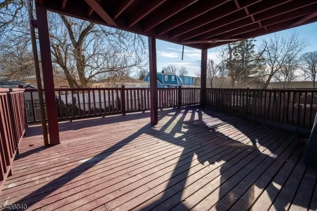 a view of balcony with wooden floor