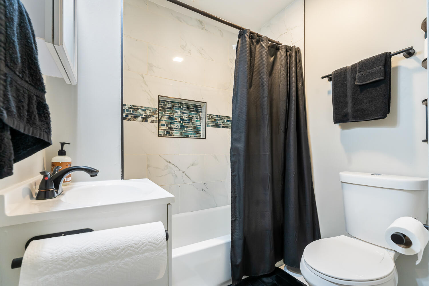 1111 Truman Street Hammond, IN 46320 - Photo 12 of 24 a bathroom with a sink a toilet a mirror and shower
