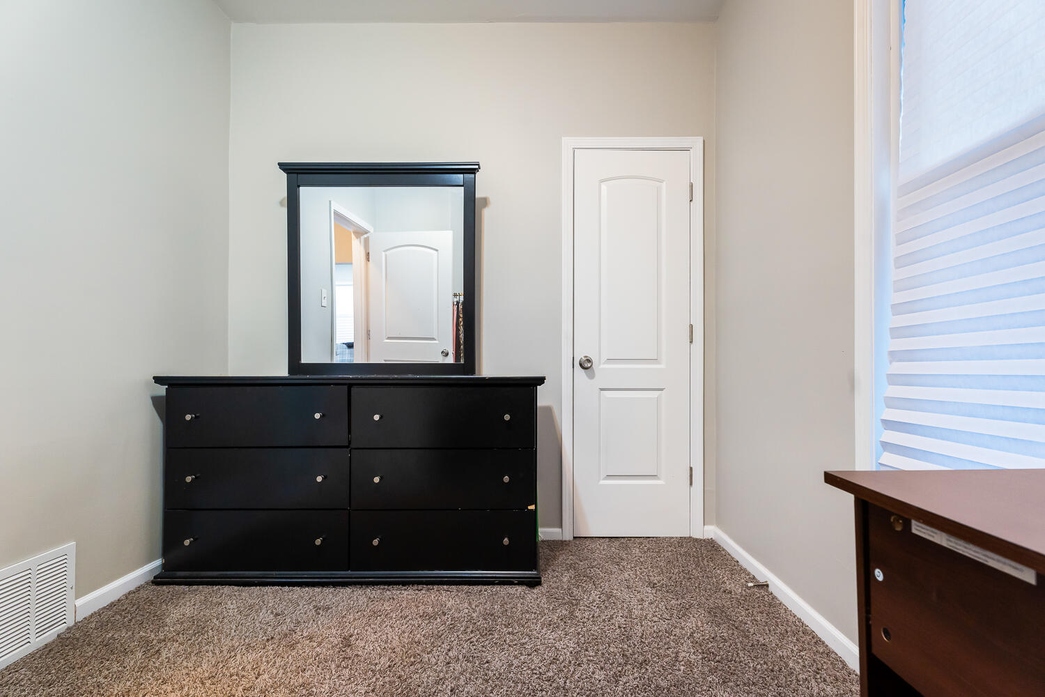 1111 Truman Street Hammond, IN 46320 - Photo 15 of 24 a room with a mirror and a dresser