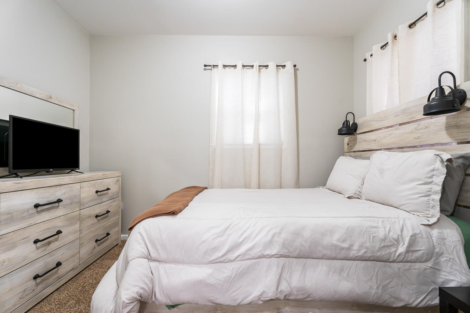 1111 Truman Street Hammond, IN 46320 - Photo 9 of 24 a bedroom with a bed and a flat screen tv