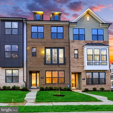 a view of a brick house with a yard