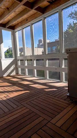 a view of room with wooden floor