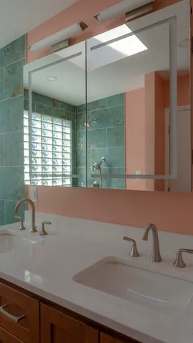 a view of hallway with wooden floor and brick wall
