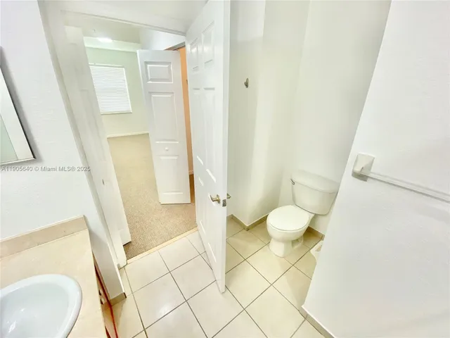 a bathroom with a sink and toilet