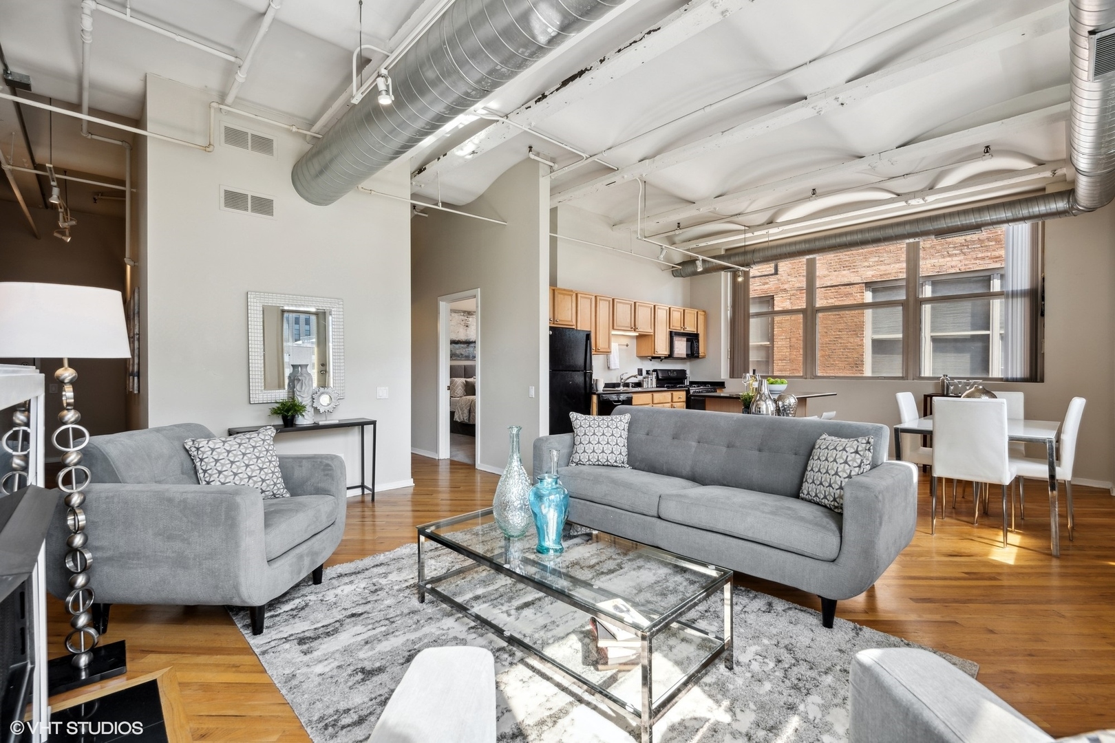 500 South Clinton Street, Unit 410 Chicago, IL 60607 - Photo 8 of 17 a living room with furniture and a large window