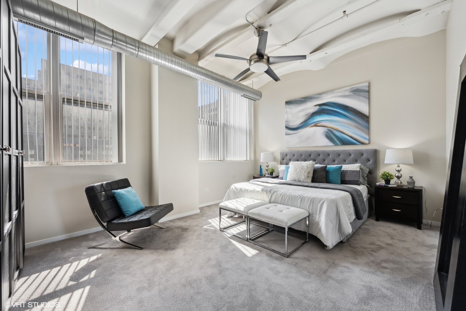 500 South Clinton Street, Unit 410 Chicago, IL 60607 - Photo 10 of 17 a bedroom with a bed chair and window