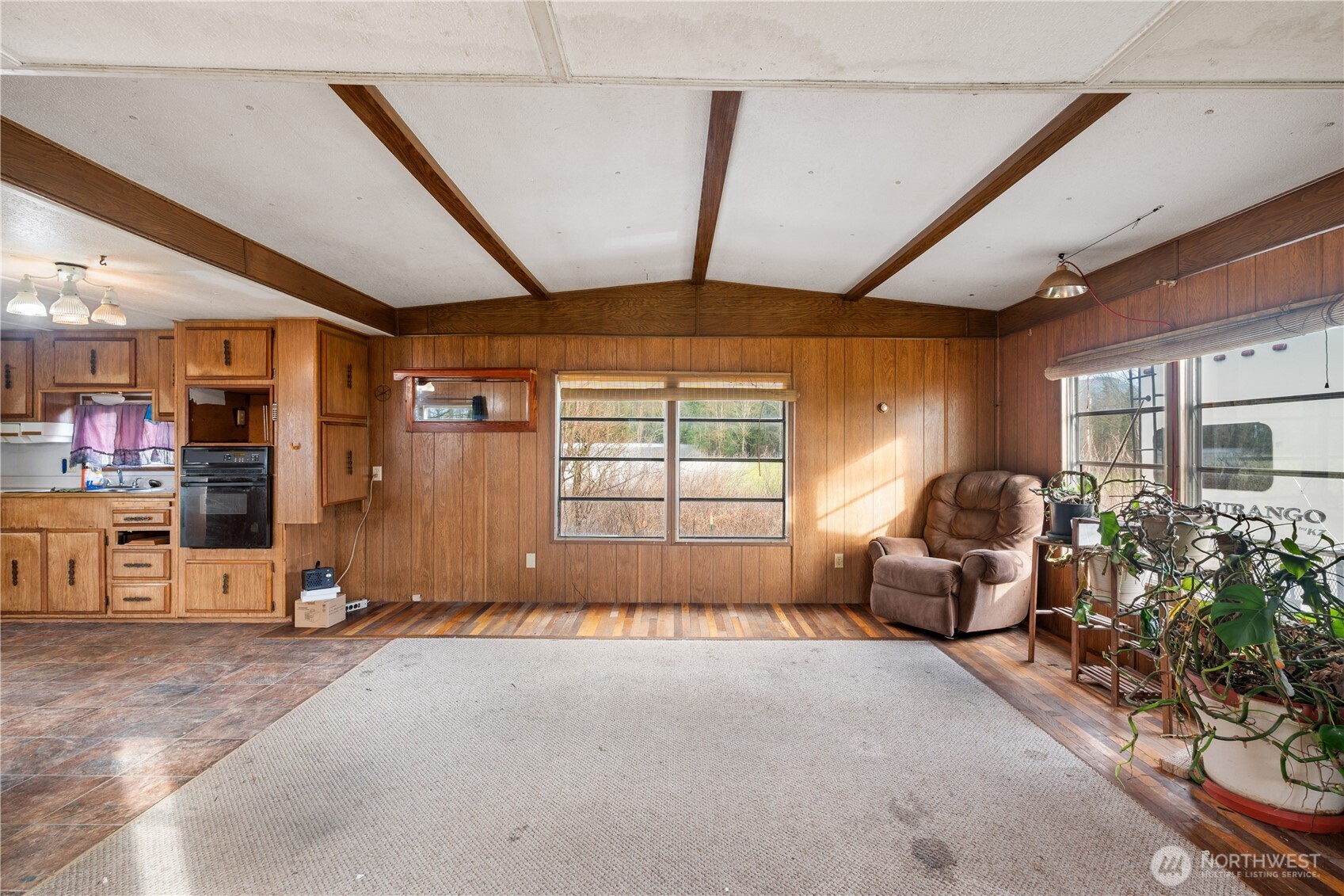 3090 Cole Road Everson, WA 98247 - Photo 8 of 22 a living room with furniture a flat screen tv and windows