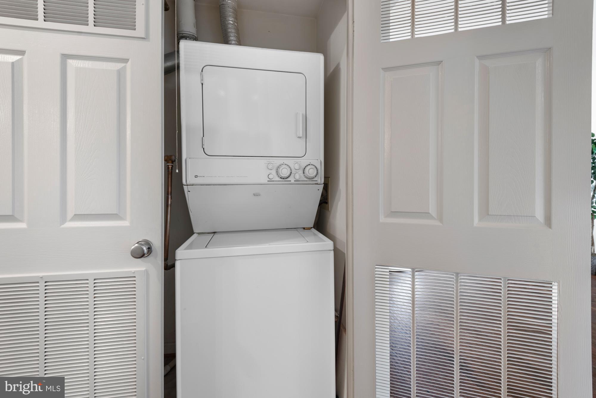 2001 12th Street Northwest, Unit 306 Washington, DC 20009 - Photo 21 of 36 a utility room with dryer and washer