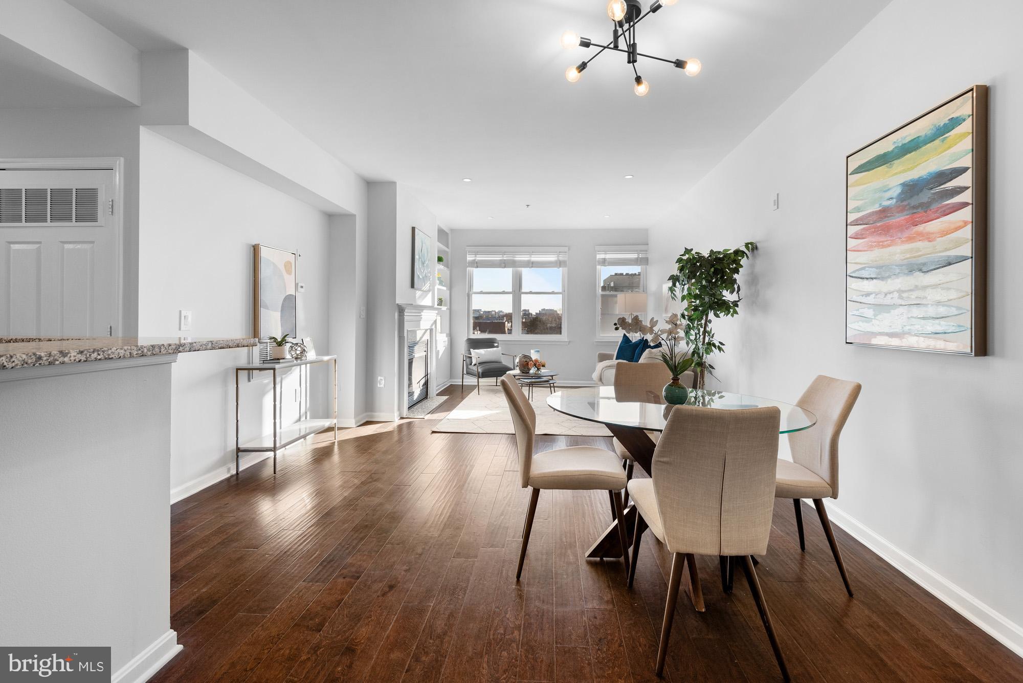 2001 12th Street Northwest, Unit 306 Washington, DC 20009 - Photo 3 of 36 a view of a dining room with furniture window and wooden floor
