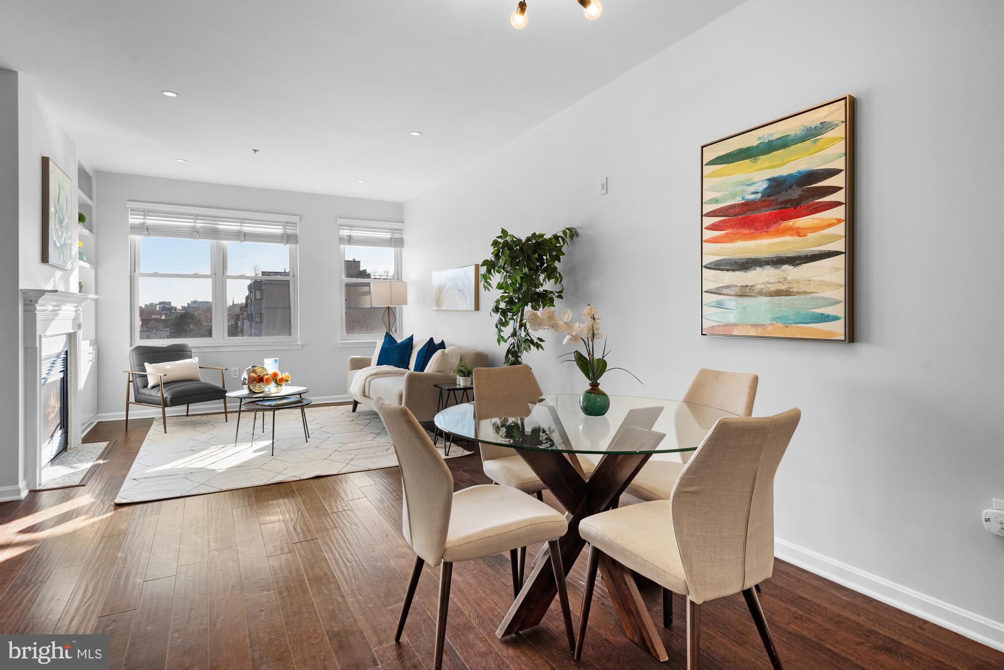 2001 12th Street Northwest, Unit 306 Washington, DC 20009 - Photo 5 of 36 a view of a dining room with furniture and wooden floor