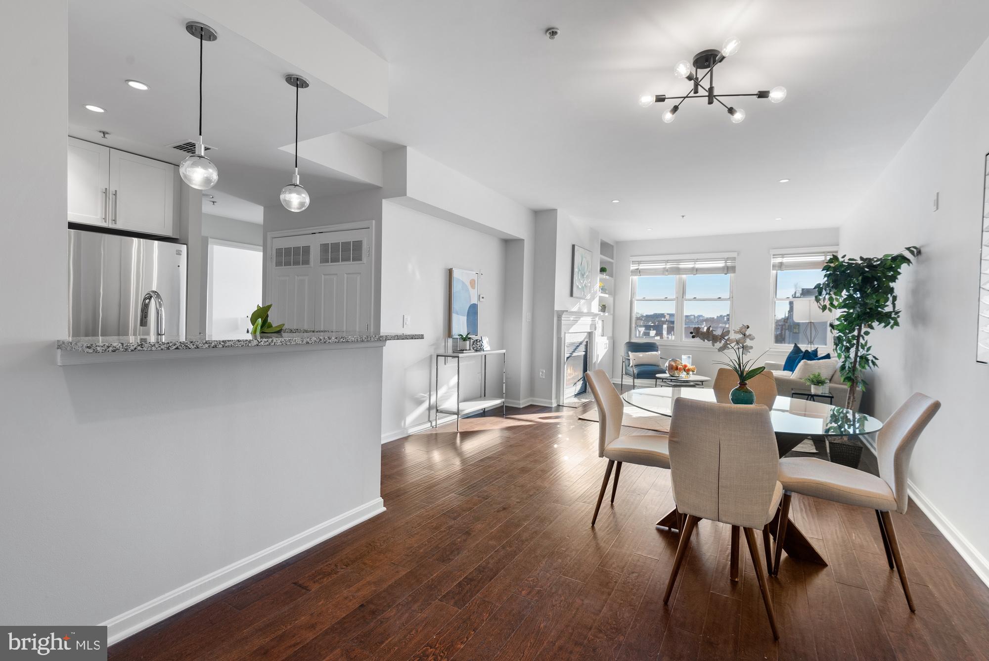 2001 12th Street Northwest, Unit 306 Washington, DC 20009 - Photo 6 of 36 a view of a dining room with furniture and wooden floor