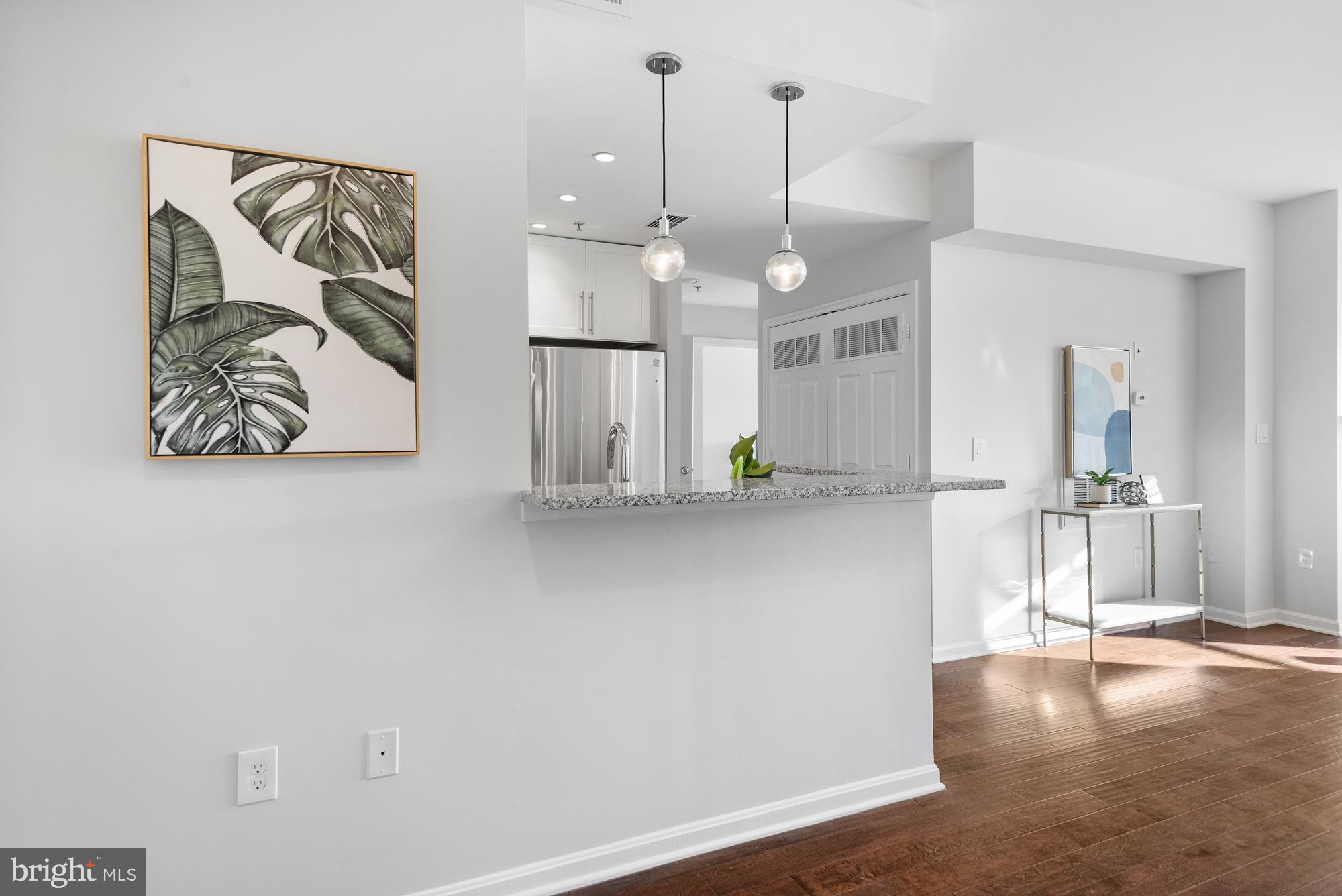 2001 12th Street Northwest, Unit 306 Washington, DC 20009 - Photo 8 of 36 a view of kitchen with furniture and wooden floor