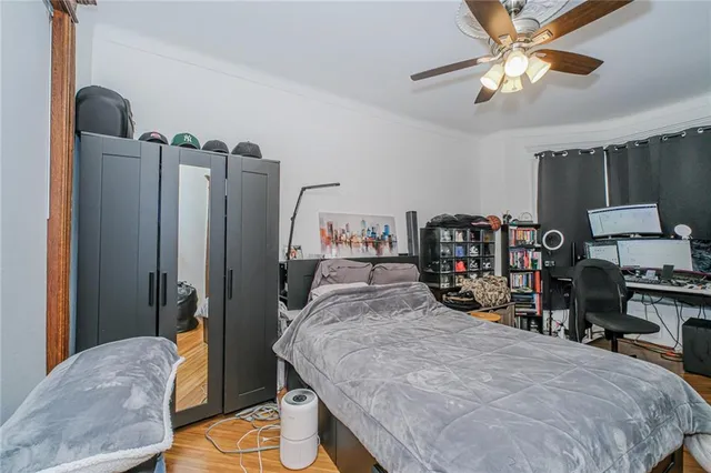 a bedroom with bed and a closet