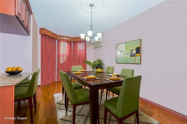 a dining room with furniture and chandelier