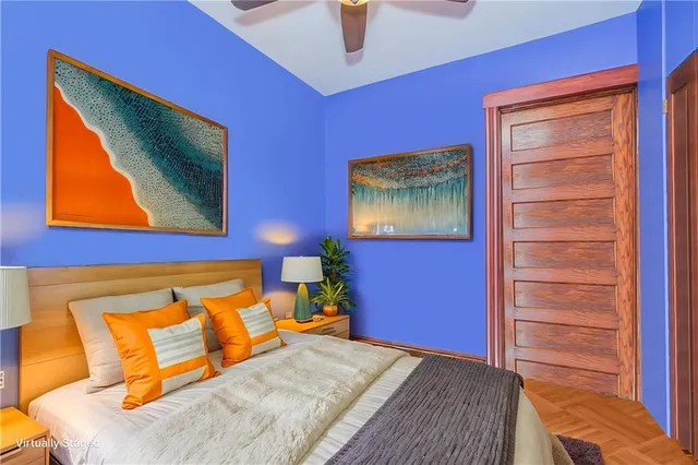 a bedroom with a bed and dresser