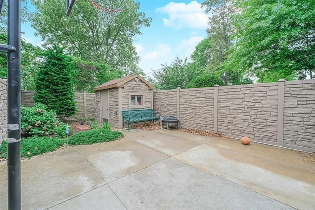 a view of house with backyard and garden