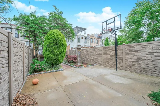 a front view of a brick building with large windows