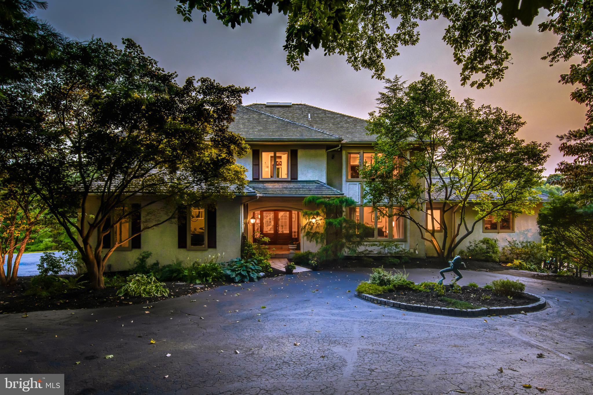 242 Ravenscliff Road Wayne, PA 19087 - Photo 2 of 49 a front view of a house with garden