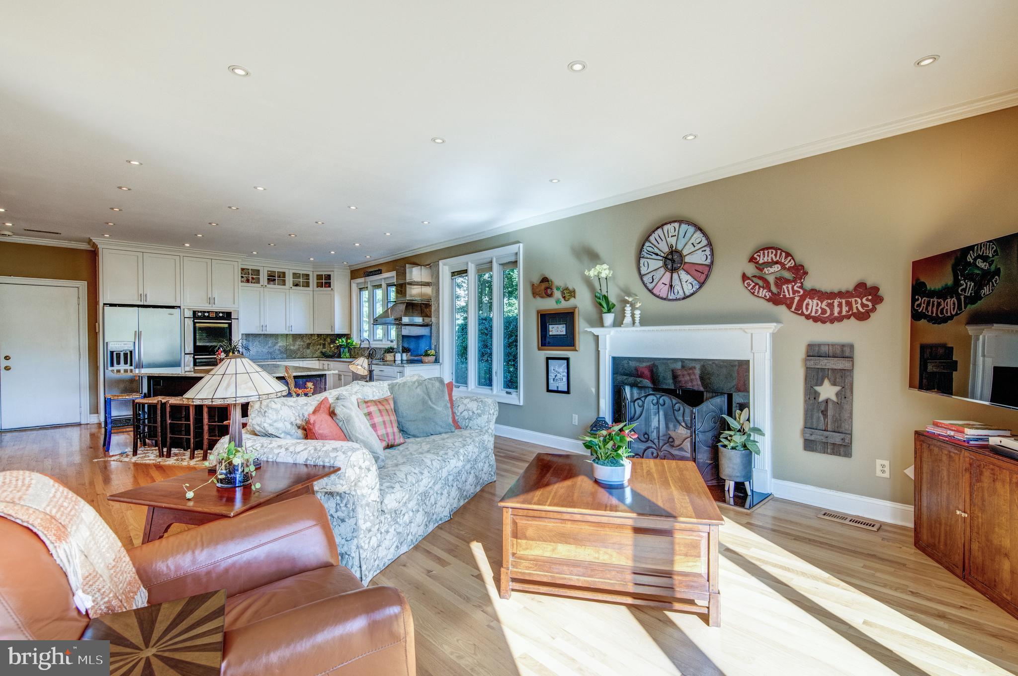 242 Ravenscliff Road Wayne, PA 19087 - Photo 11 of 49 a living room with furniture and a fireplace