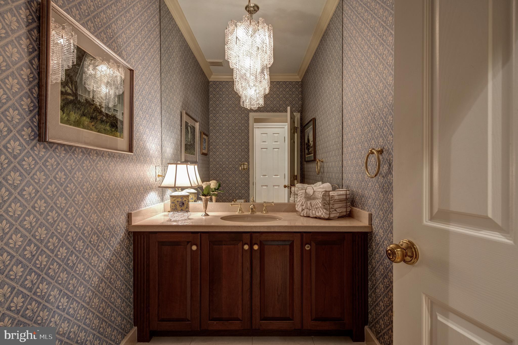 242 Ravenscliff Road Wayne, PA 19087 - Photo 14 of 49 a bathroom with a granite countertop sink a large mirror and vanity