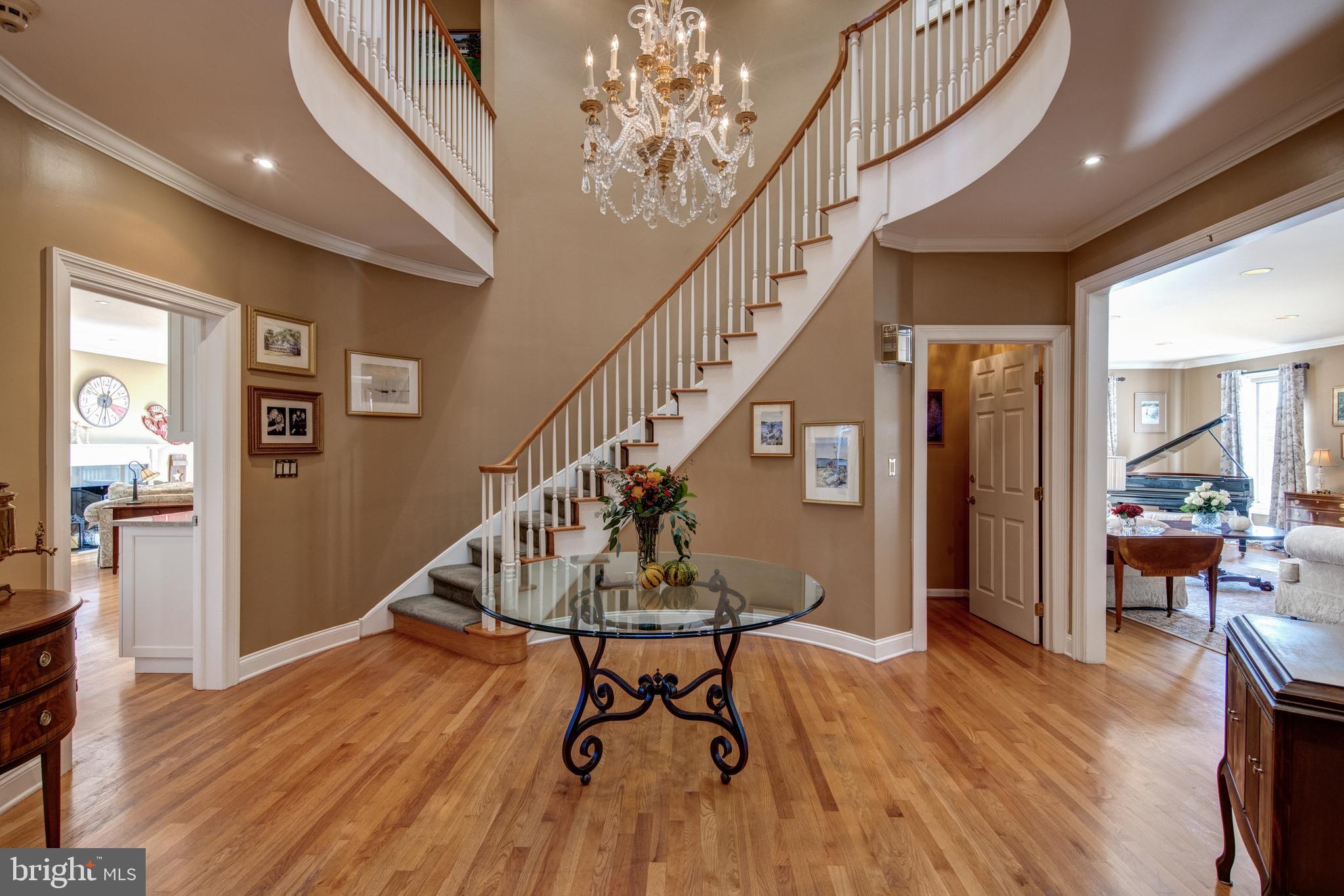 242 Ravenscliff Road Wayne, PA 19087 - Photo 3 of 49 a view of a livingroom with wooden floor and stairs