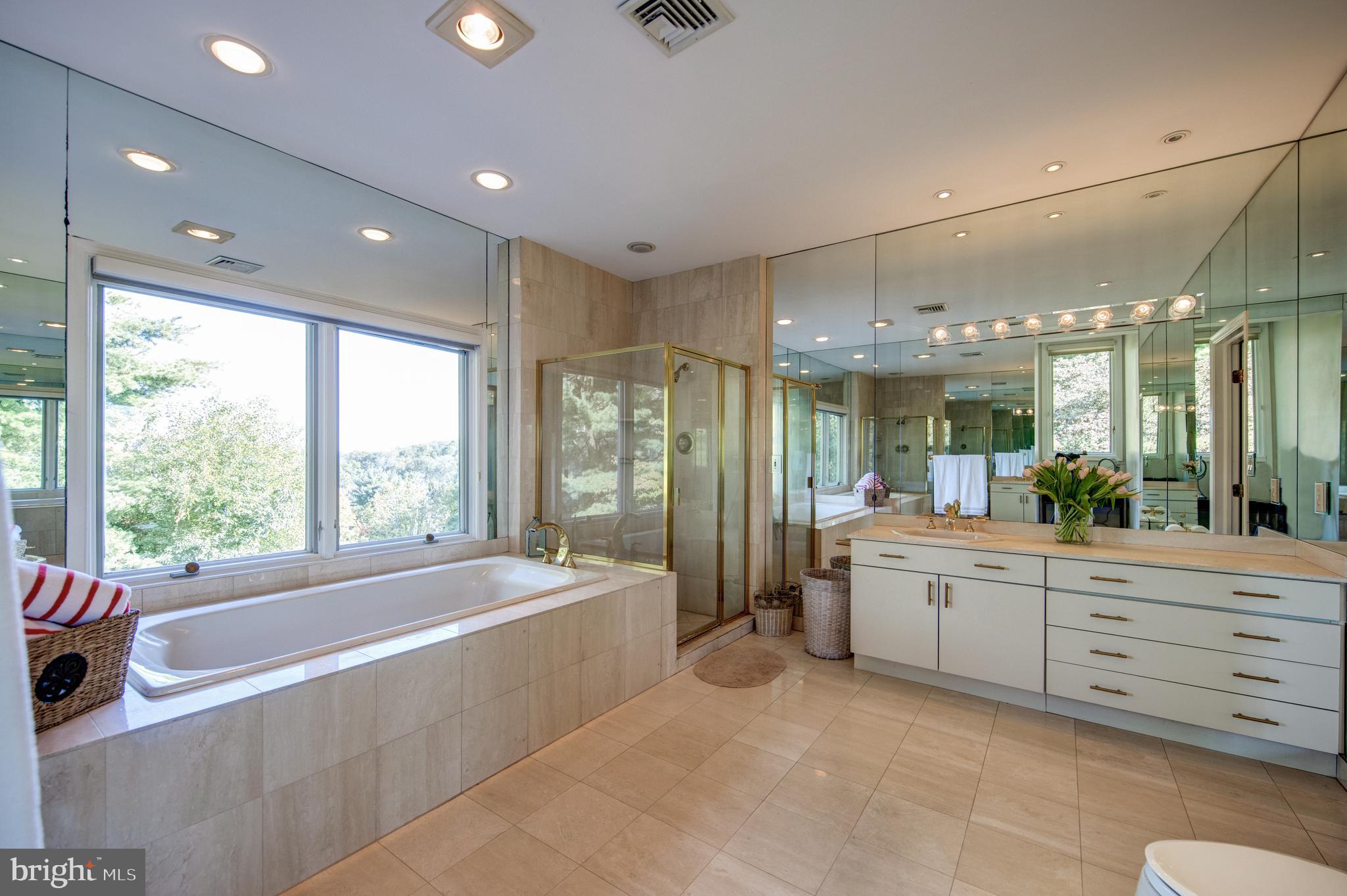 242 Ravenscliff Road Wayne, PA 19087 - Photo 25 of 49 a large spacious bathroom with a large tub and shower