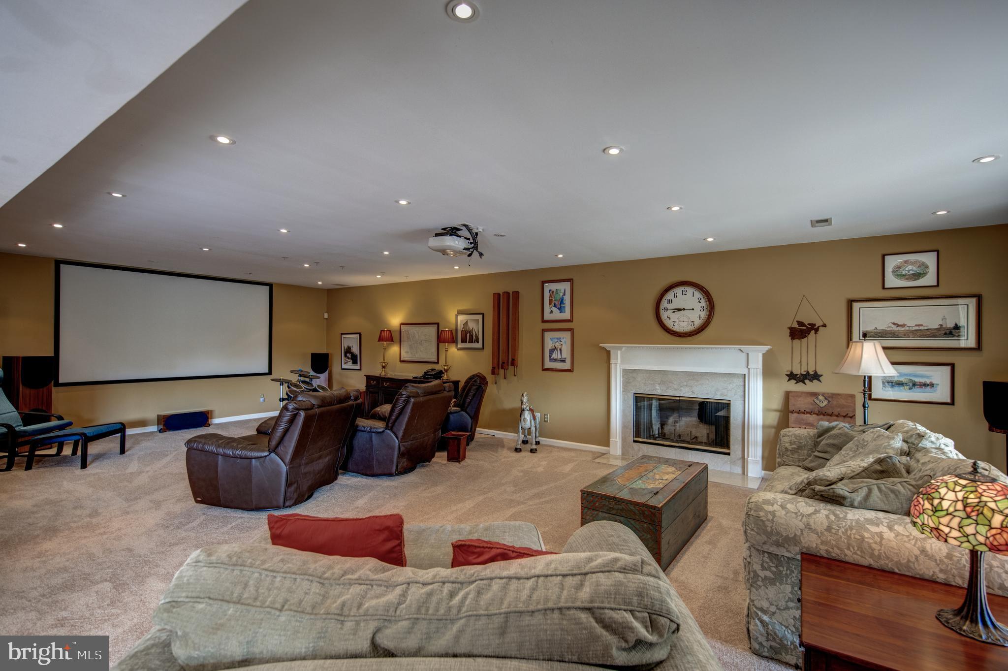 242 Ravenscliff Road Wayne, PA 19087 - Photo 35 of 49 a living room with furniture and a fireplace