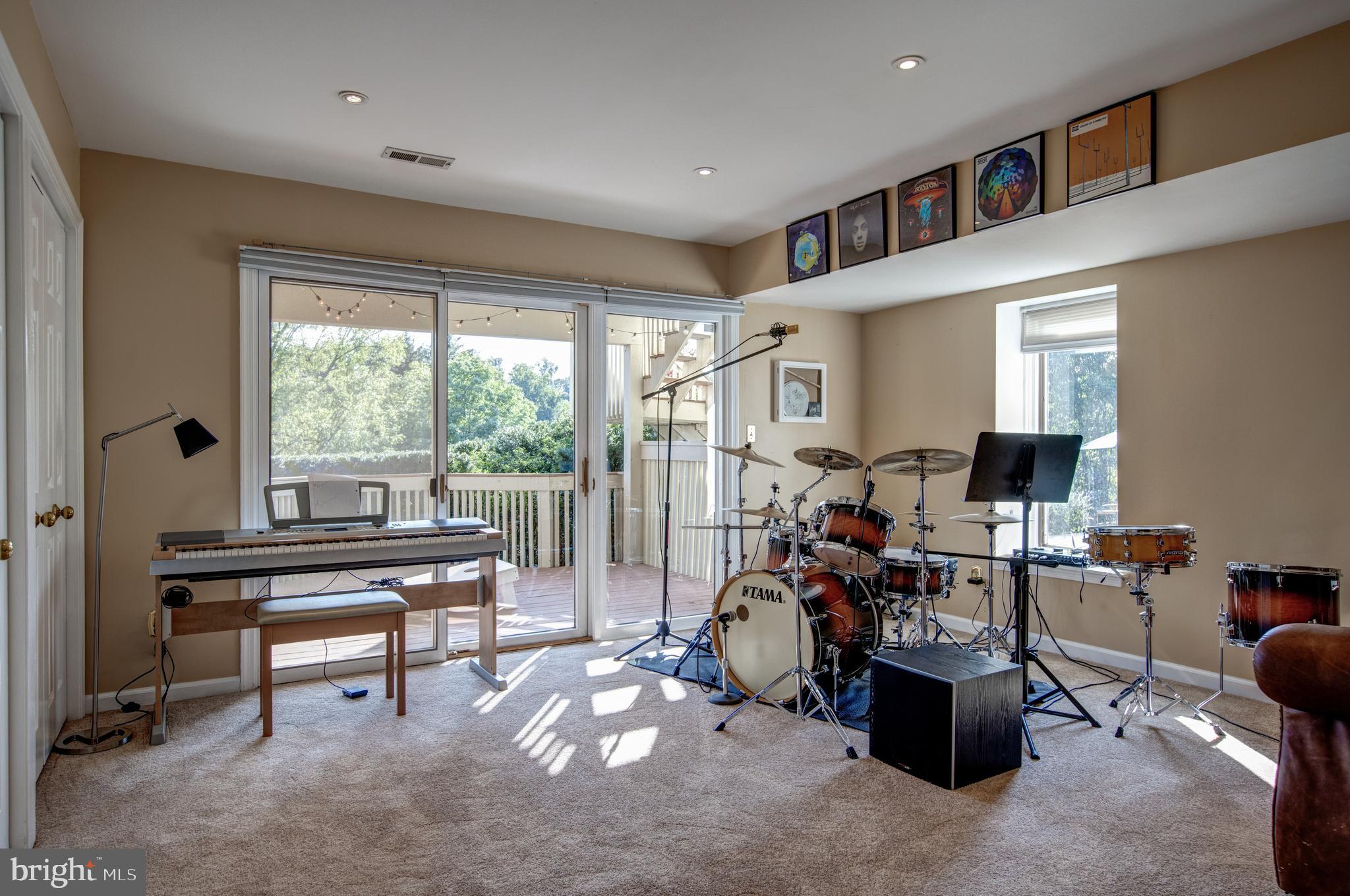 242 Ravenscliff Road Wayne, PA 19087 - Photo 39 of 49 a living room with furniture a window and a flat screen tv