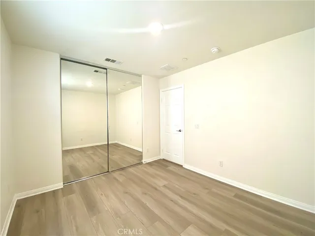 a bathroom with a granite countertop sink a mirror and a bathtub