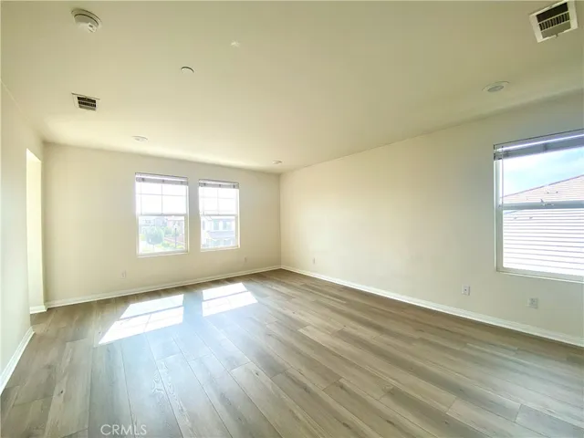 a large bathroom with a glass door shower a sink and a mirror