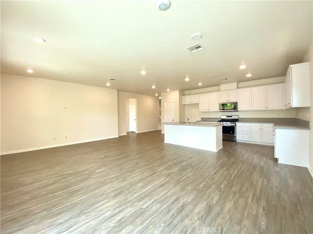 a view of kitchen with wooden floor