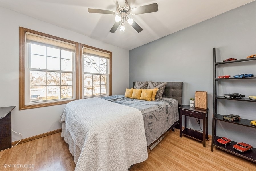 4539 Opal Drive Hoffman Estates, IL 60192 - Photo 14 of 27 a bedroom with a bed and a window