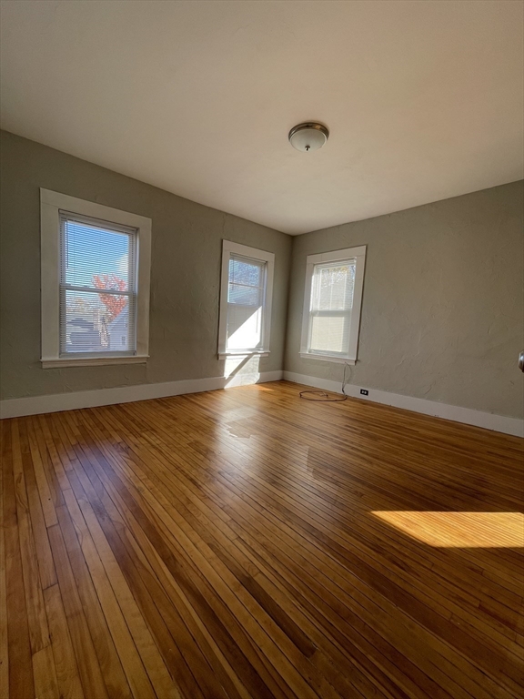 5 Freeland Terrace, Unit 3 Worcester, MA 01603 - Photo 15 of 25 a view of empty room with wooden floor and fan