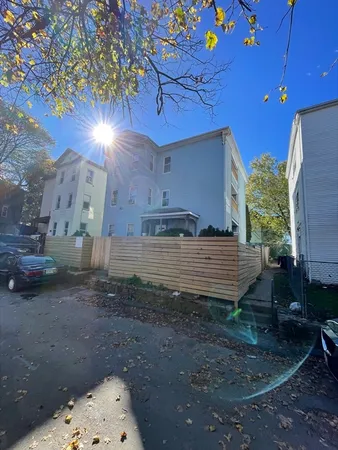 a car parked in front of a house