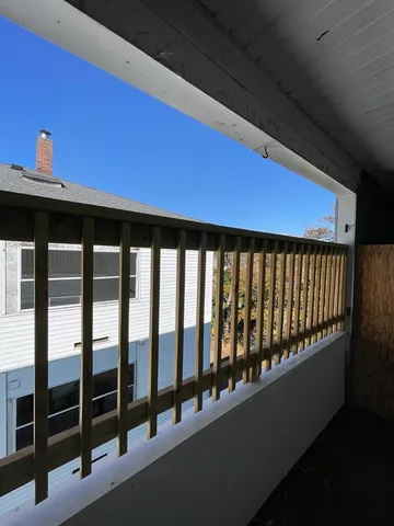 a view of a kitchen with a sink and a stove top oven