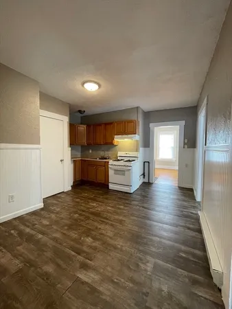 a kitchen with a stove a sink and a refrigerator