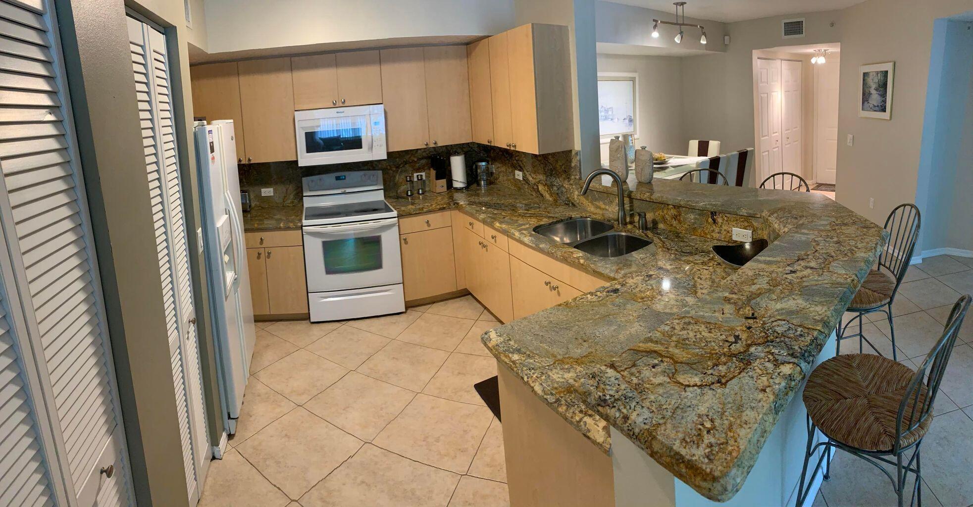 805 Villa Circle Boynton Beach, FL 33435 - Photo 1 of 21 a kitchen with stainless steel appliances granite countertop a stove a sink and a refrigerator