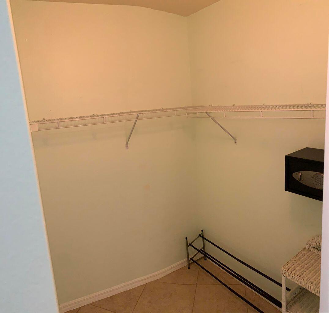 805 Villa Circle Boynton Beach, FL 33435 - Photo 12 of 21 a view of a room with racks on the wall