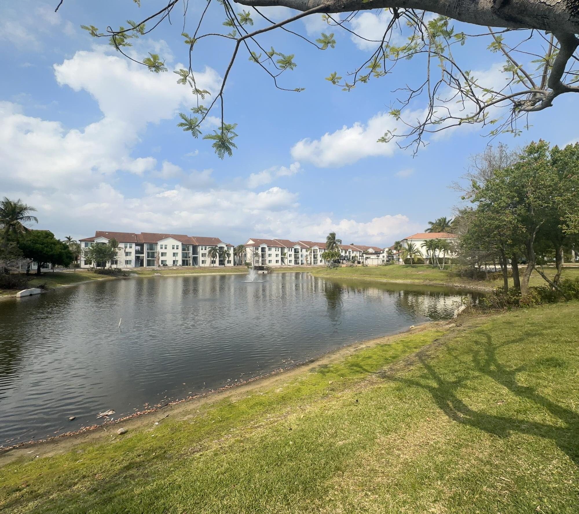 805 Villa Circle Boynton Beach, FL 33435 - Photo 20 of 21 a view of a lake with a building in the background