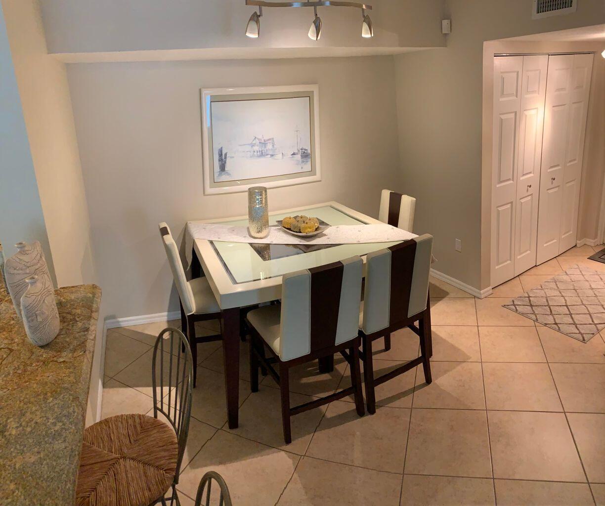 805 Villa Circle Boynton Beach, FL 33435 - Photo 3 of 21 a view of a dining room with furniture