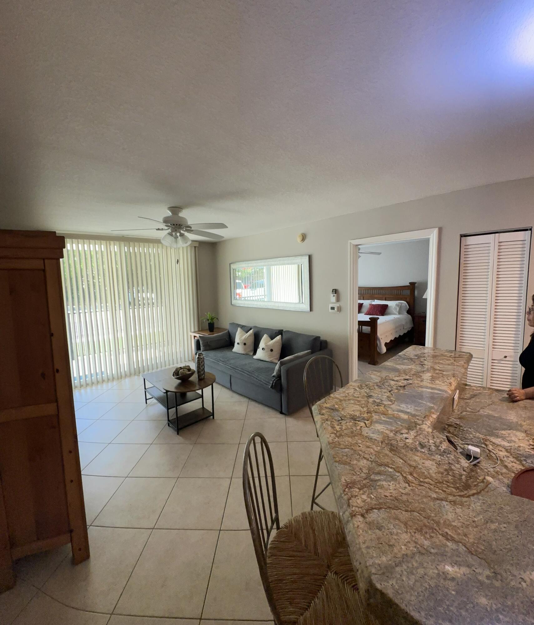 805 Villa Circle Boynton Beach, FL 33435 - Photo 5 of 21 a bedroom with furniture and a window