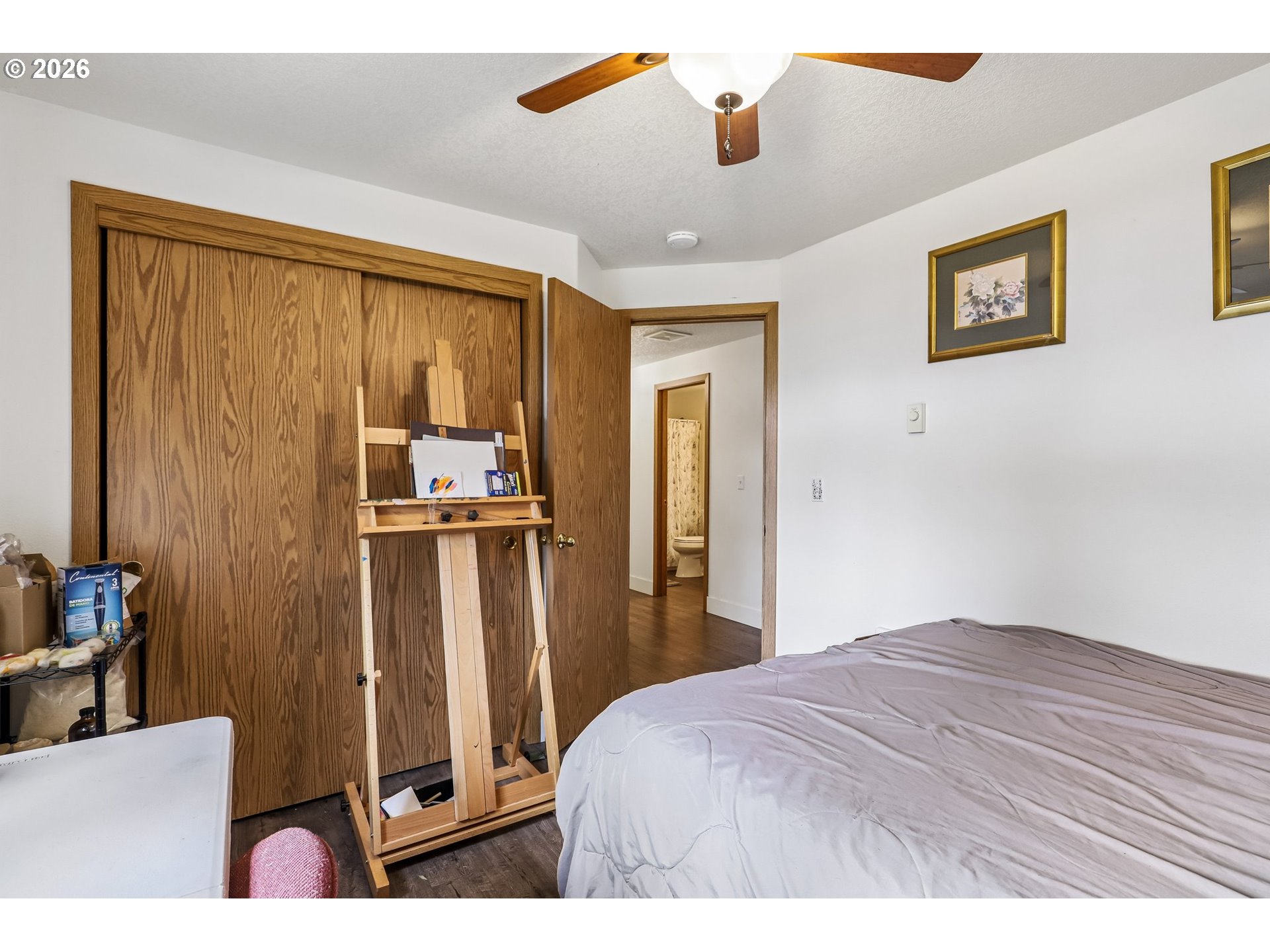 608 Southeast Sumner Street Camas, WA 98607 - Photo 17 of 39 a bedroom with a bed and a chandelier