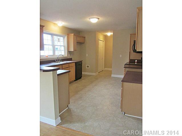 300 Sutton Spring Road York, SC 29745 - Photo 12 of 12 a kitchen with a sink and a stove