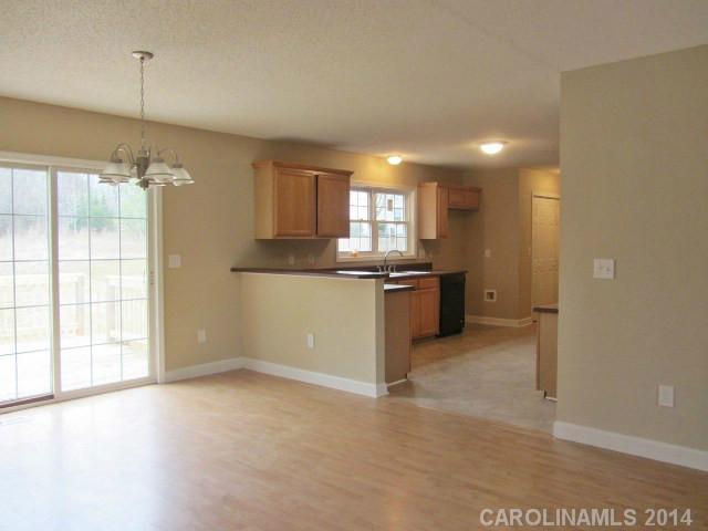 300 Sutton Spring Road York, SC 29745 - Photo 3 of 12 a view of a kitchen with a sink and dishwasher cabinet