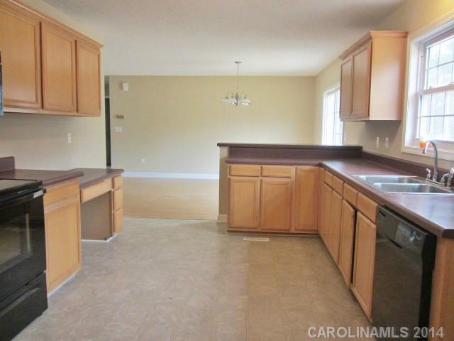 300 Sutton Spring Road York, SC 29745 - Photo 4 of 12 a kitchen with a sink and cabinets