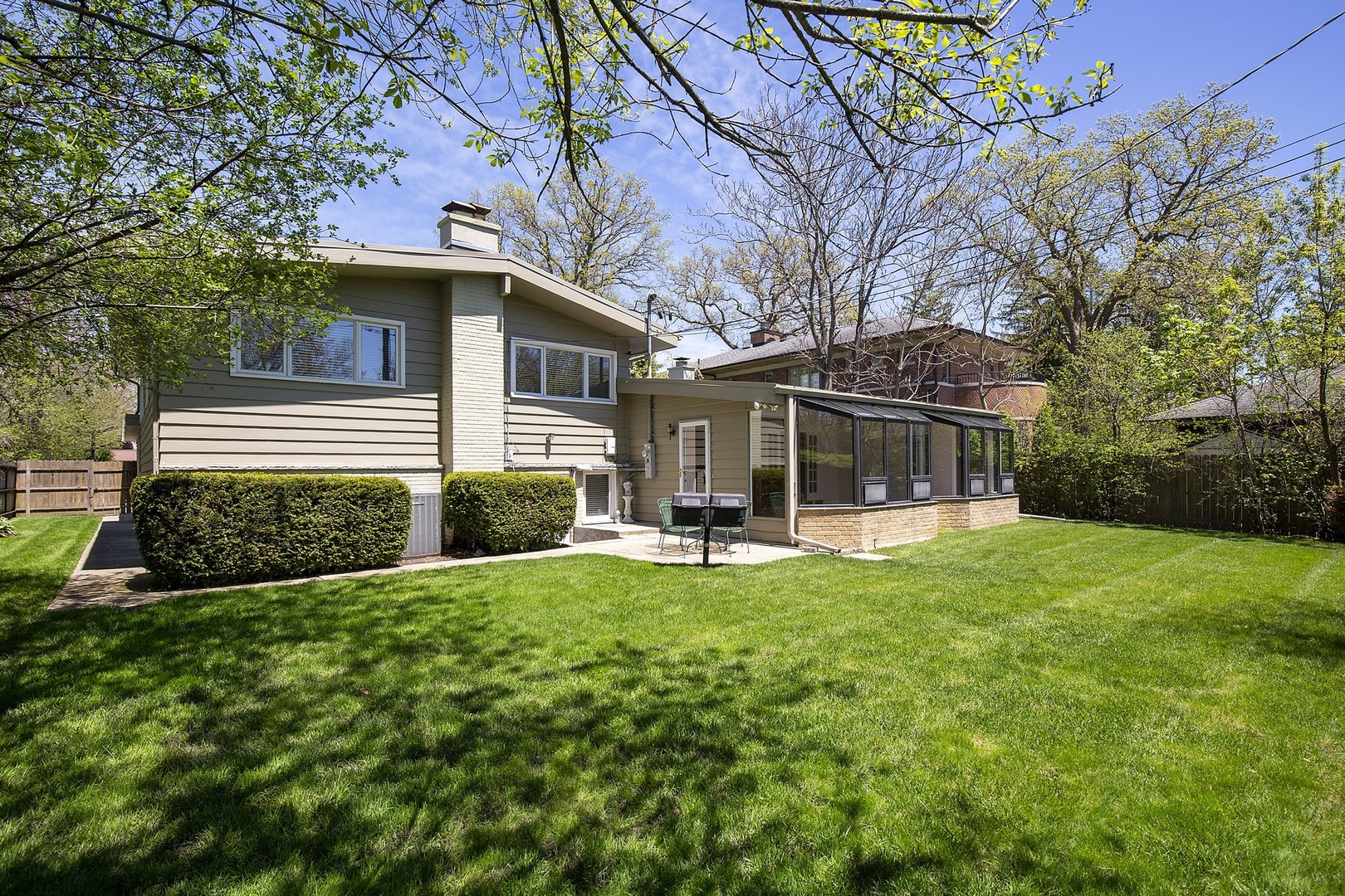 616 Dundee Road Glencoe, IL 60022 - Photo 22 of 22 a view of house with backyard space and garden